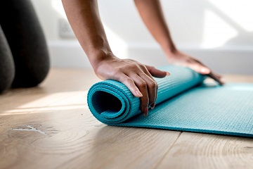 yoga mat being rolled